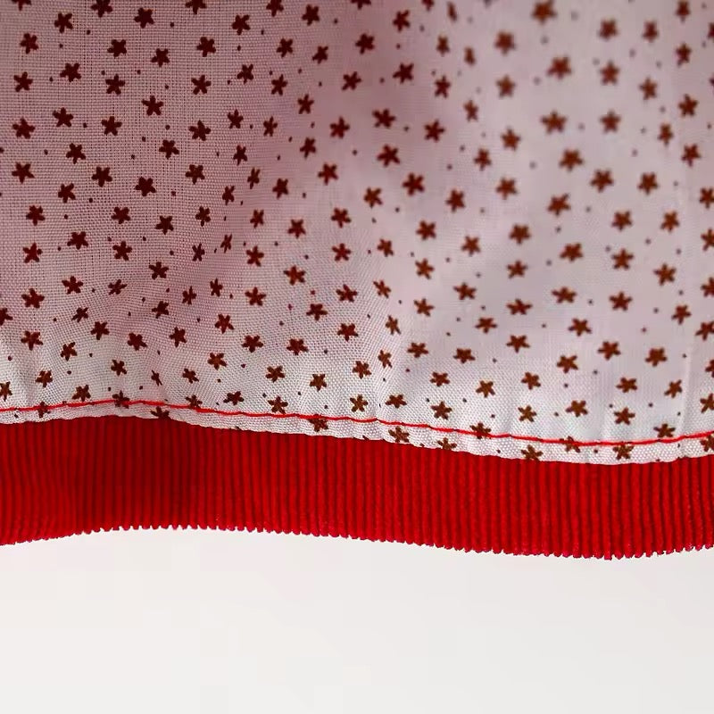 Close-up of star print lining inside red corduroy dress