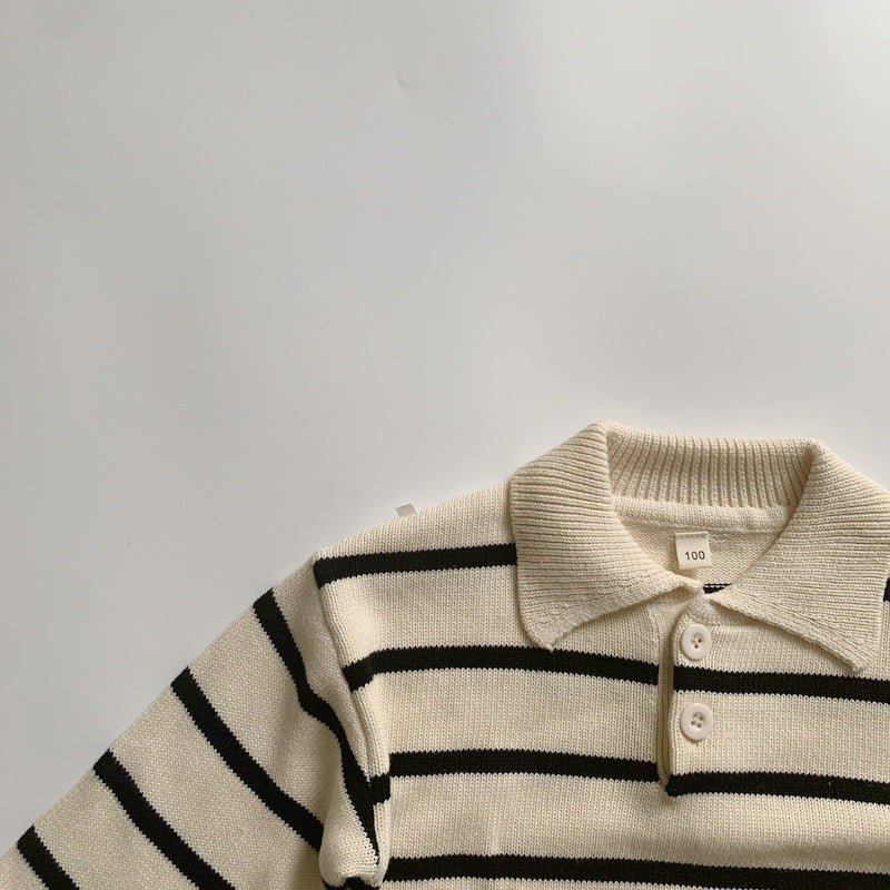 Close-up of polo collar on striped knit sweater