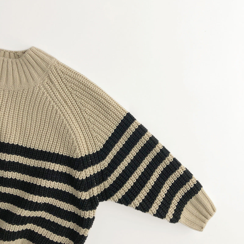 Close-up of black stripes on chunky knit sleeve