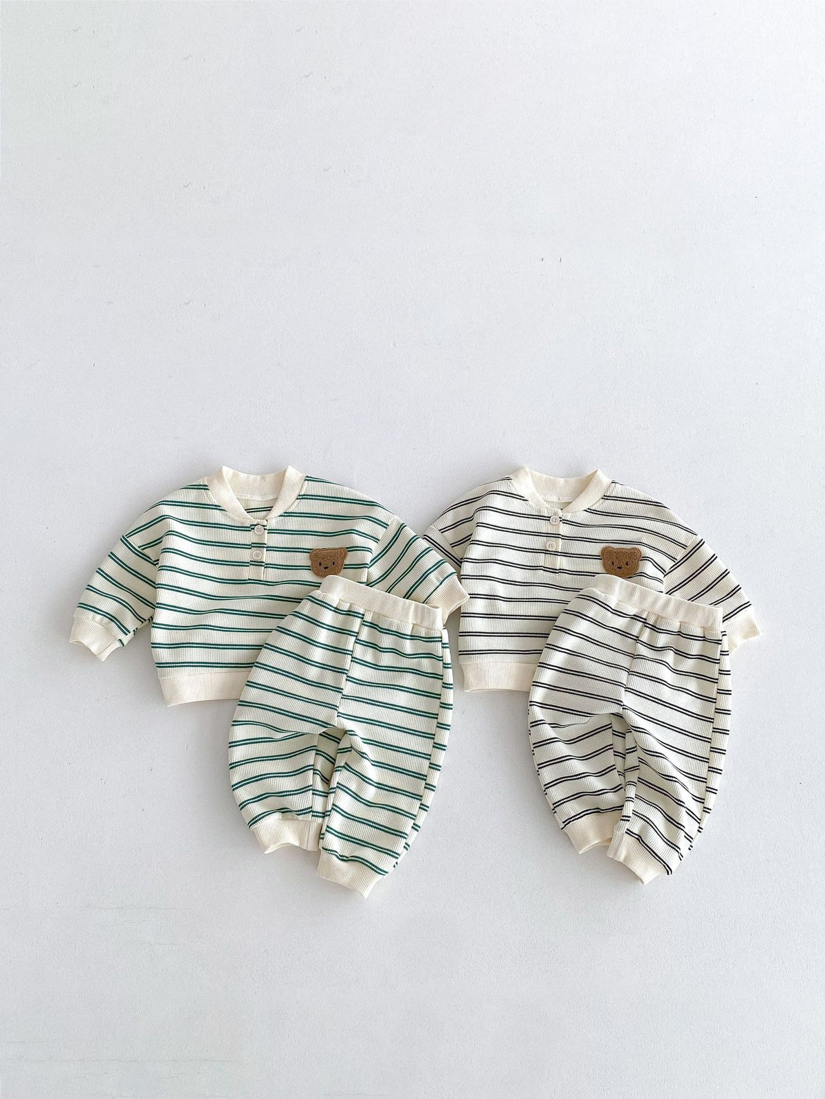 Green and gray striped sets laid flat