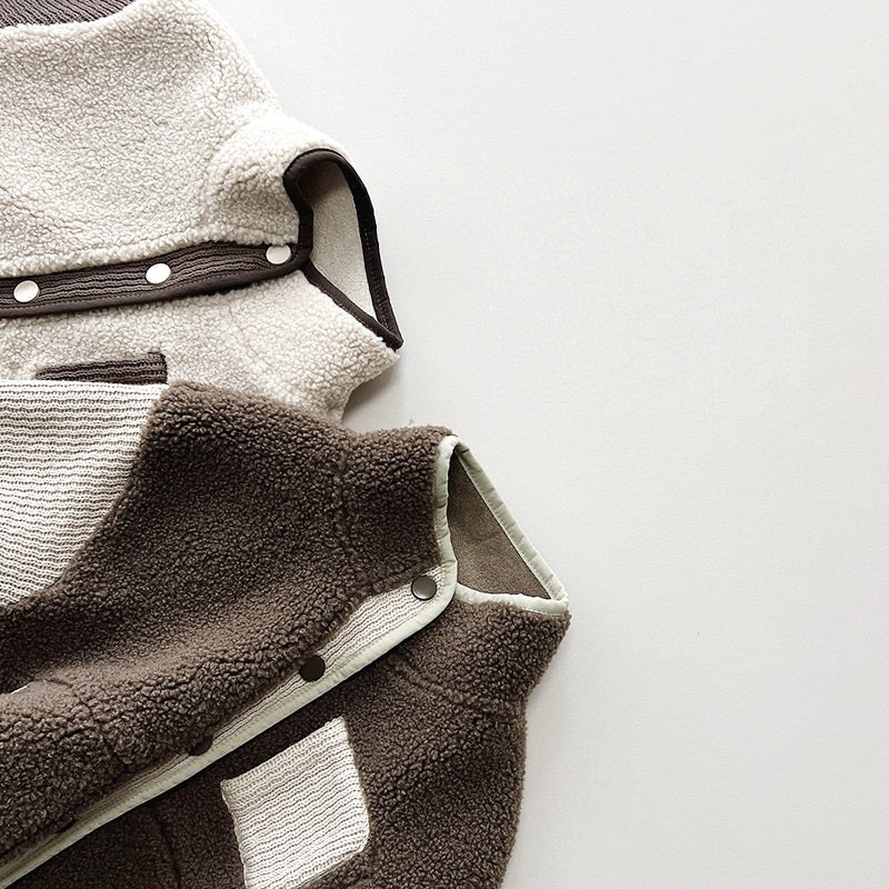 Close-up of teddy fleece texture and snap buttons