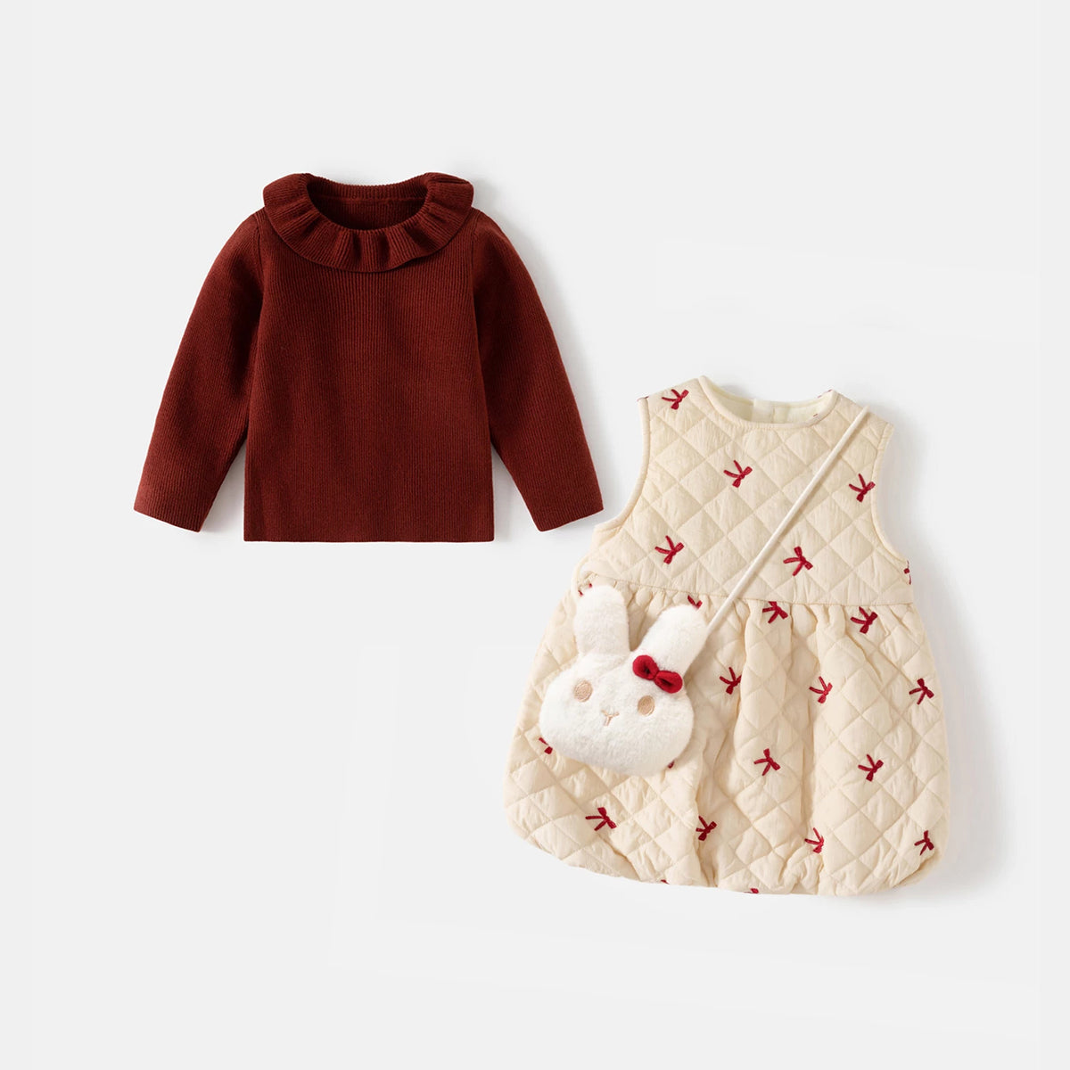 Burgundy ruffle-collar knit sweater and cream quilted pinafore dress with bunny crossbody bag, flat lay