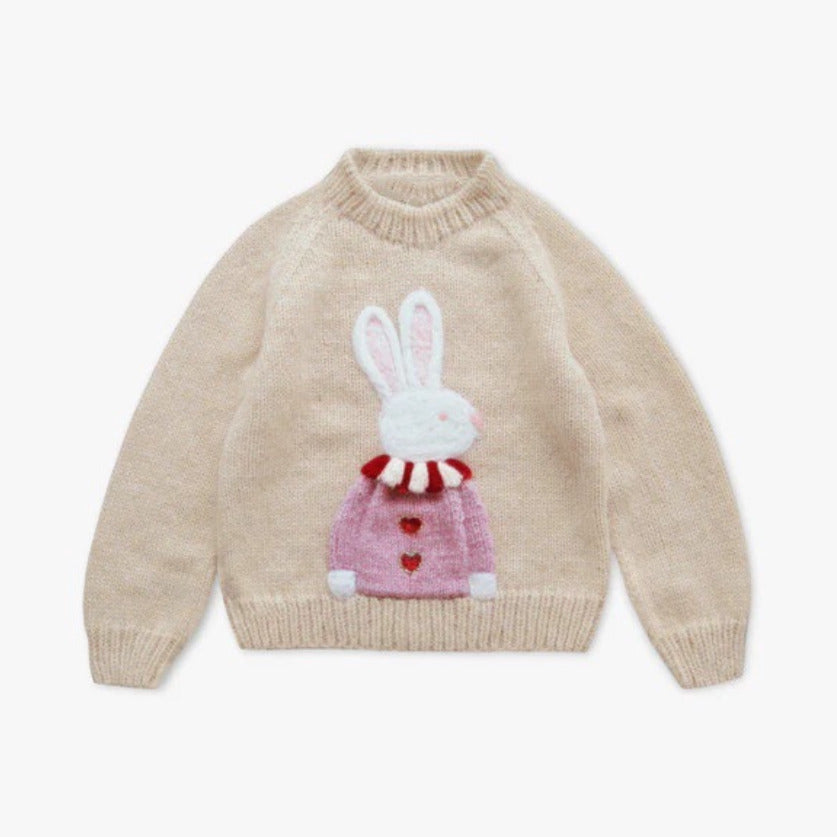 Cream kids knit sweater with a fluffy bunny in a pink jumper, flat lay
