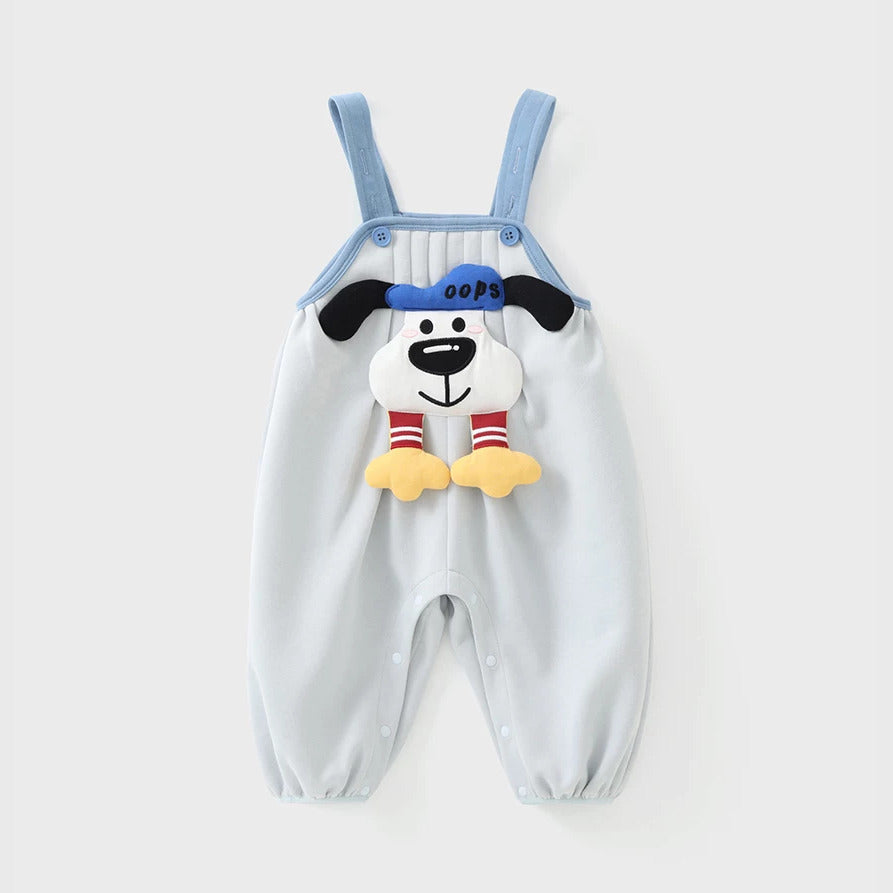Close-up of sky blue baby dungarees with 3D puppy and pintuck bib