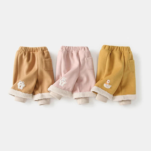 Camel, blush and mustard fleece-lined baby pants with sherpa cuffs, flat lay