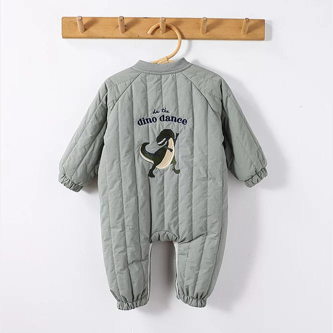 Back of a sage quilted baby romper with dinosaur embroidery