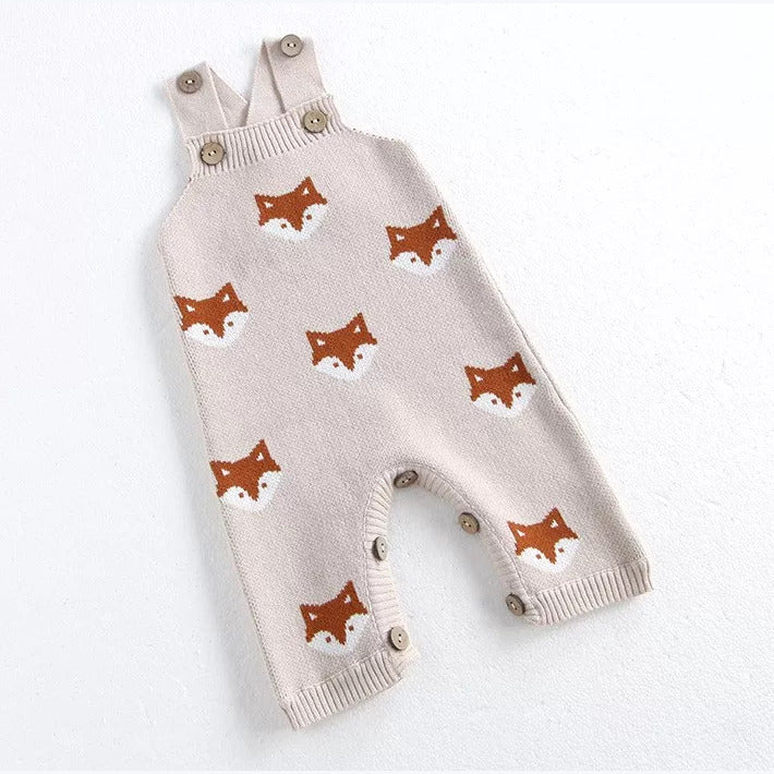 Fox knit baby dungarees with wooden buttons, angled flat lay