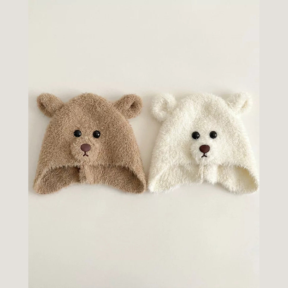 Close-up of latte and cream plush bear hats