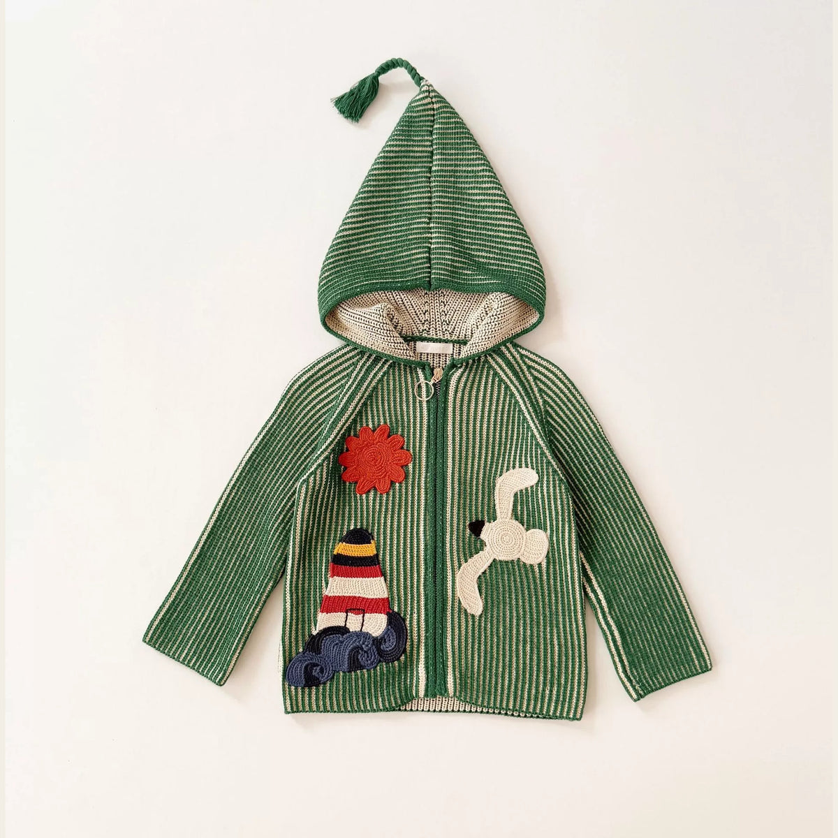 Green ribbed knit kids cardigan with pixie hood and lighthouse, sun and seagull patches, flat lay