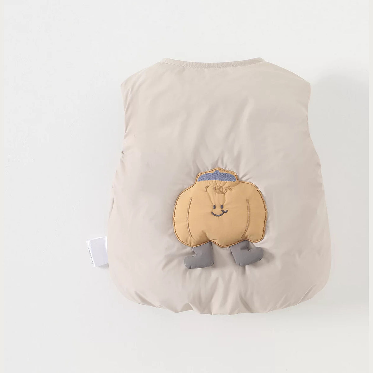 Cream baby down vest with a puffy pumpkin appliqué on the back