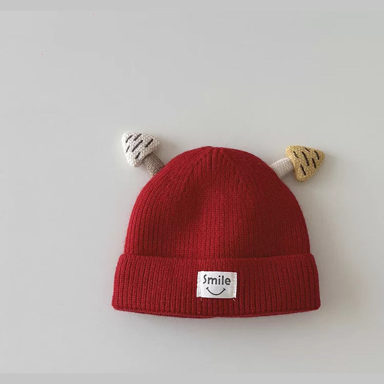 Cherry red mushroom knit beanie with smile patch