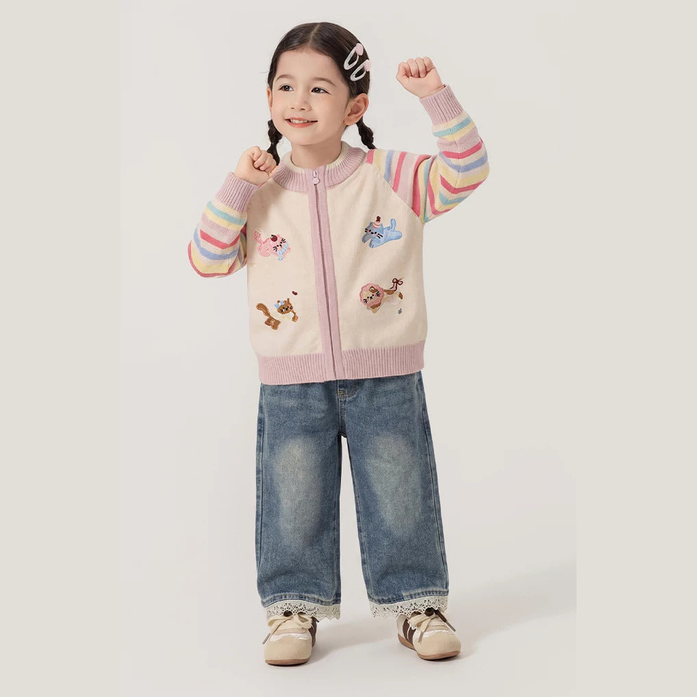 Girl in rainbow embroidered cardigan and wide-leg jeans