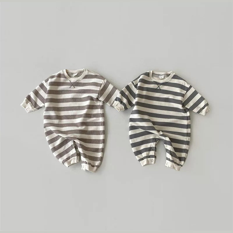 Mocha and charcoal wide-stripe baby sweatshirt rompers laid flat side by side