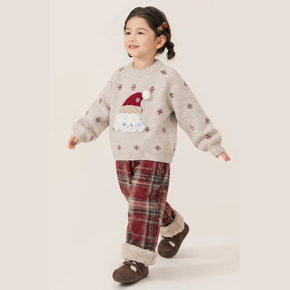 Girl walking in the snowflake puppy sweater and plaid sherpa-cuff pants