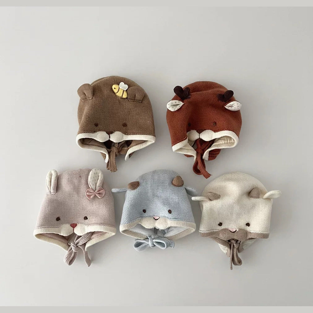 Five knit animal baby bonnets: bear with bee, deer, bunny, blue lamb and cream lamb