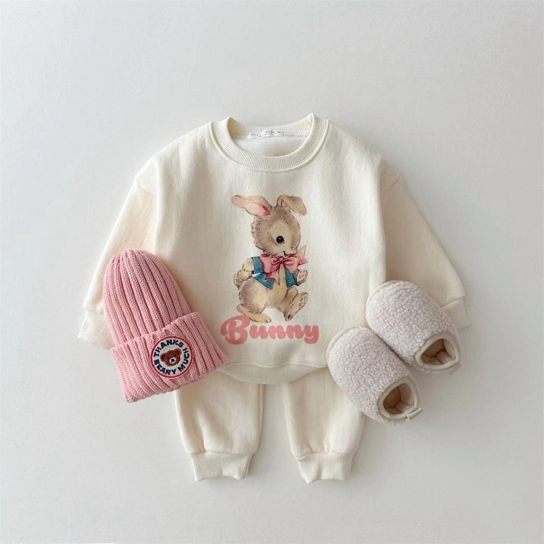 Cream sweatshirt and pants set with vintage bunny print and pink beanie