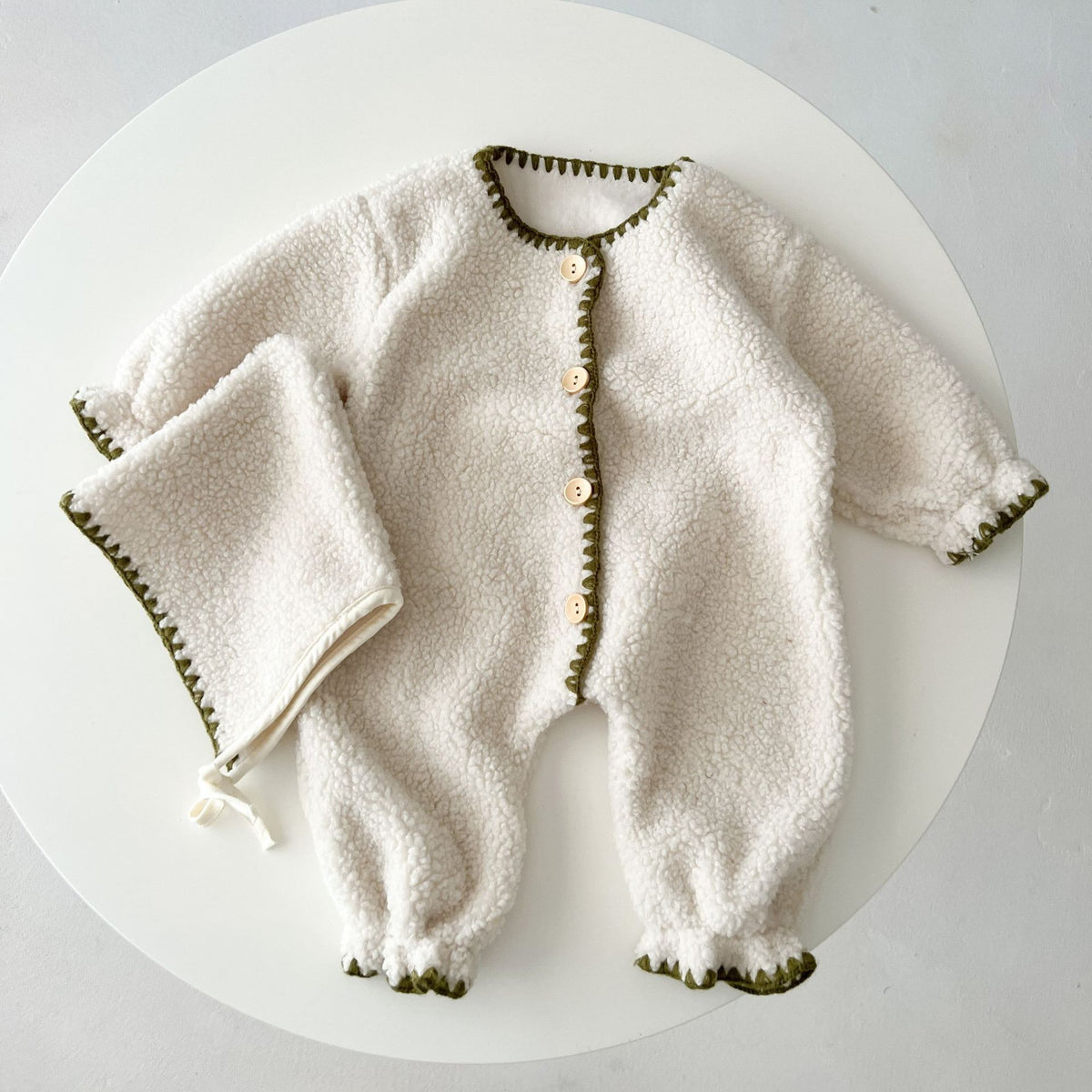 White teddy fleece baby romper with matching bonnet