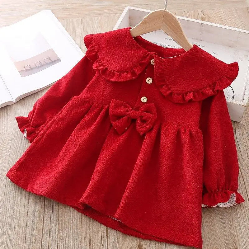 Wine red corduroy princess dress on a hanger