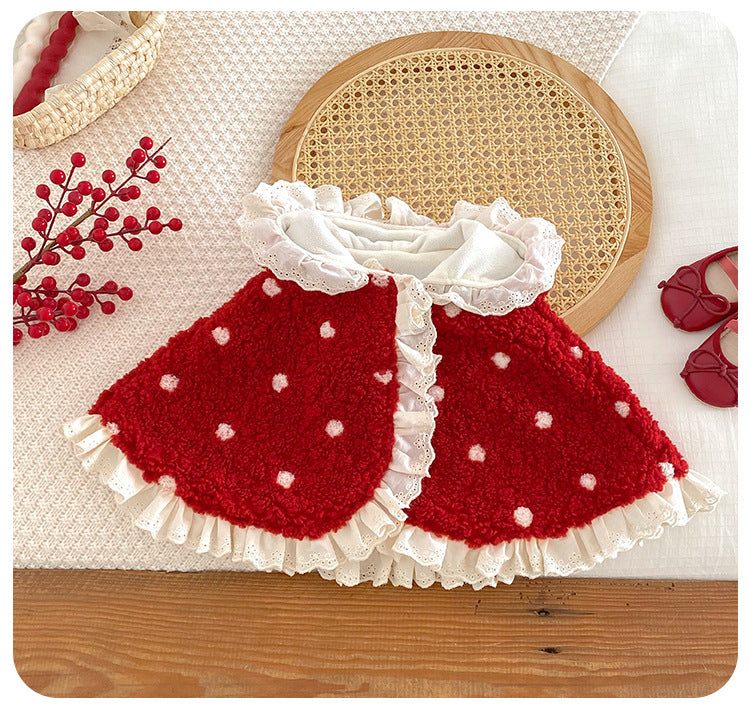 Front view of red winterberry baby cape with frilled collar