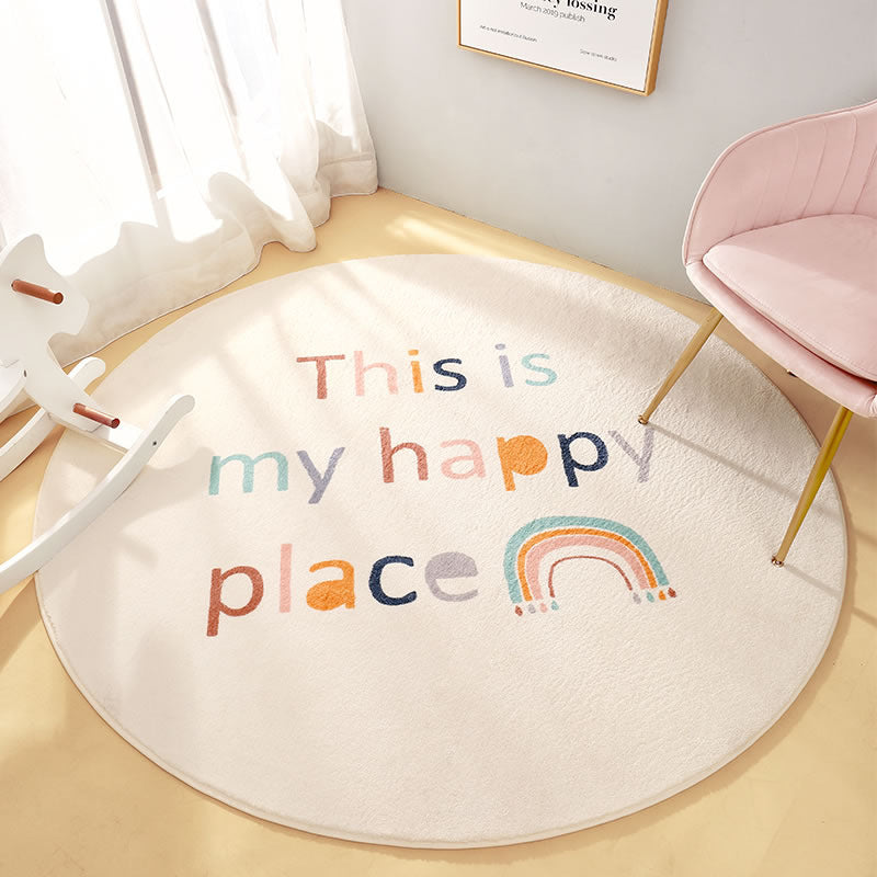 Colorful round nursery rug with "This is my happy place" text and rainbow design