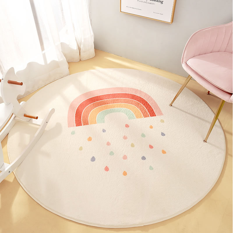 Round kids rug featuring pastel rainbow and raindrop design in cream colorway