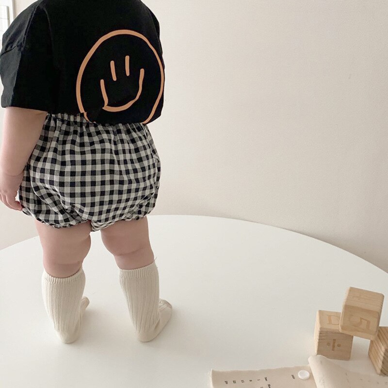 Smiley Face T-shirt and Plaid Shorts