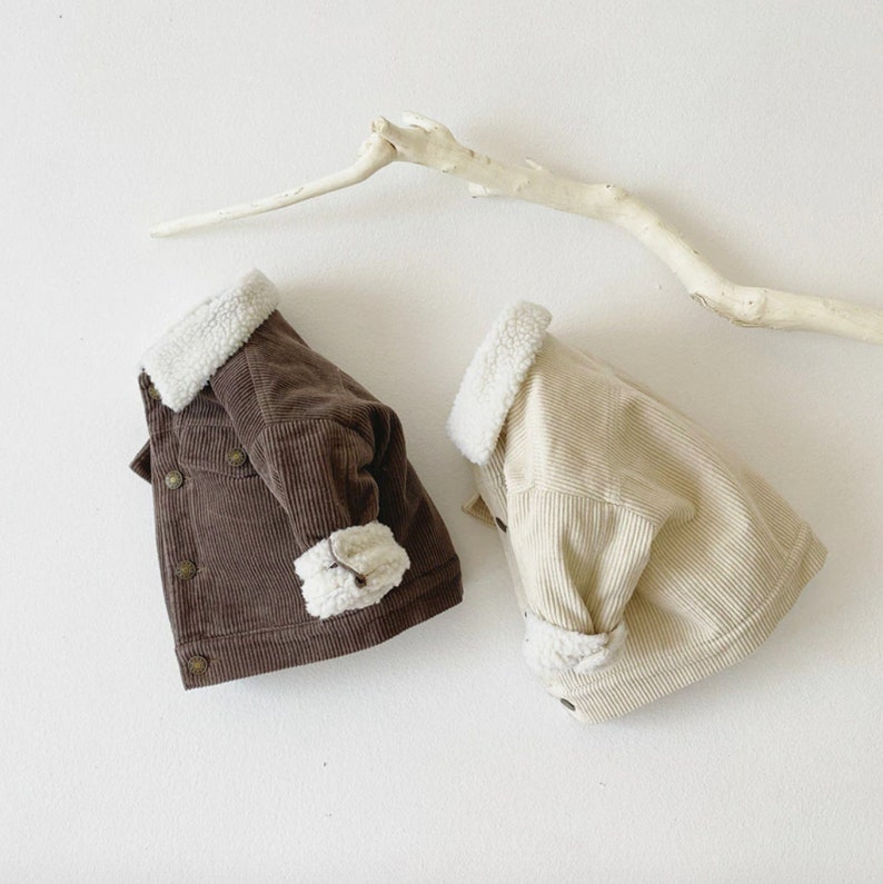 Folded brown and white baby corduroy jackets