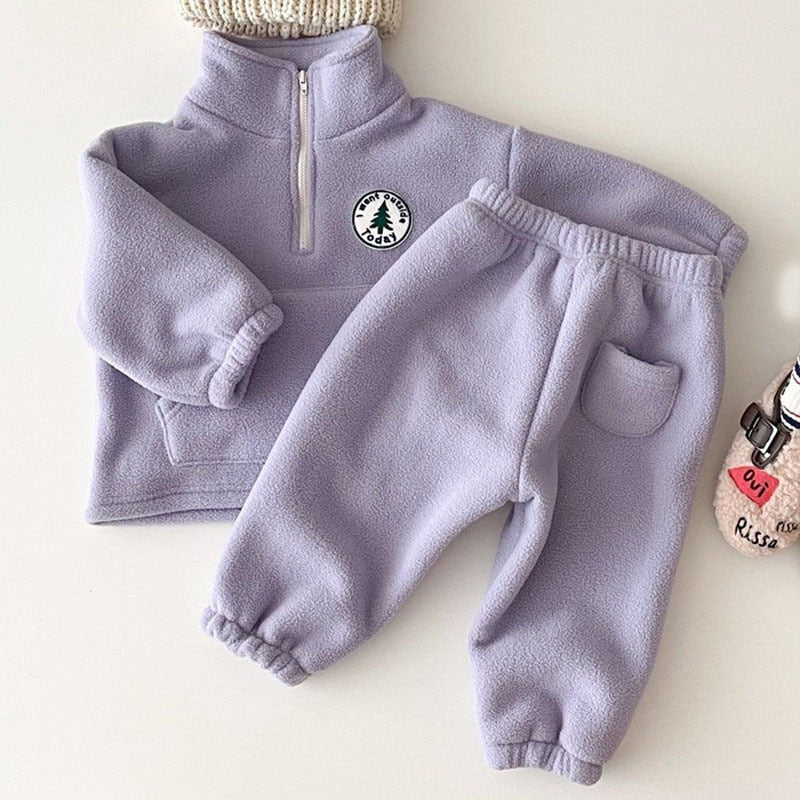 Purple polar fleece pullover and jogger pants flat lay