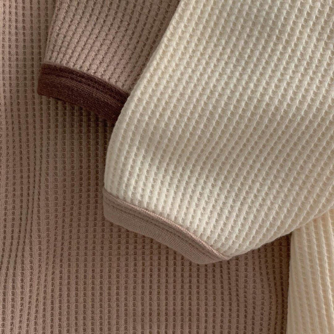 Contrast cuff detail on waffle knit baby rompers