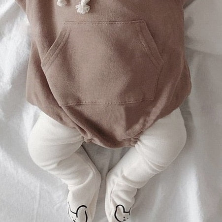 Baby wearing white bear face footed leggings