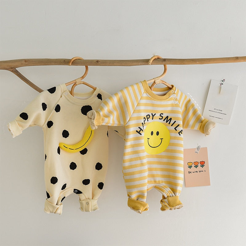 Banana dot and Happy Smile rompers hanging