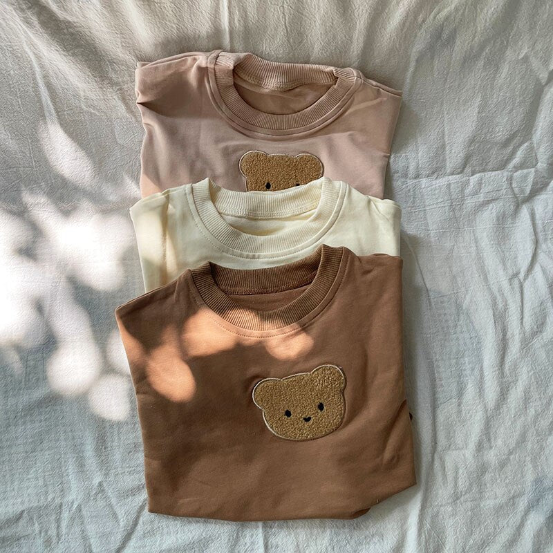 Stacked bear sweatshirts in three colours