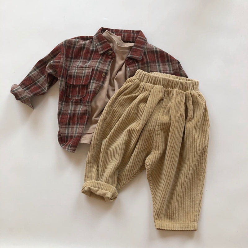 Beige corduroy pants with plaid shirt