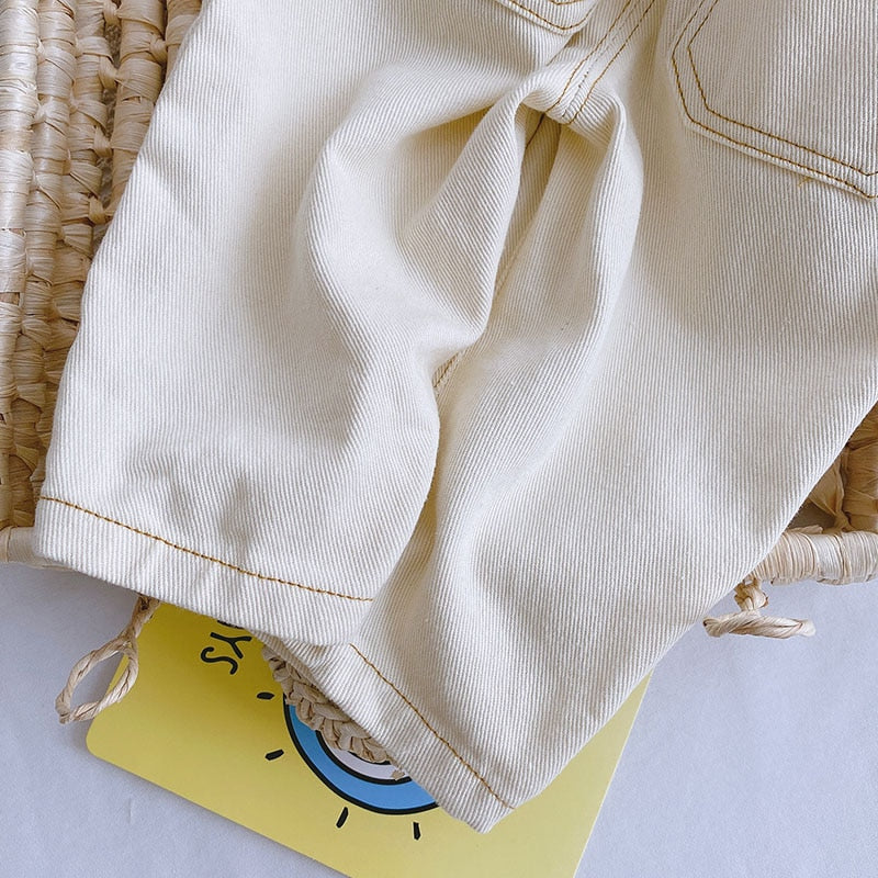 Close-up of contrast stitching on beige denim