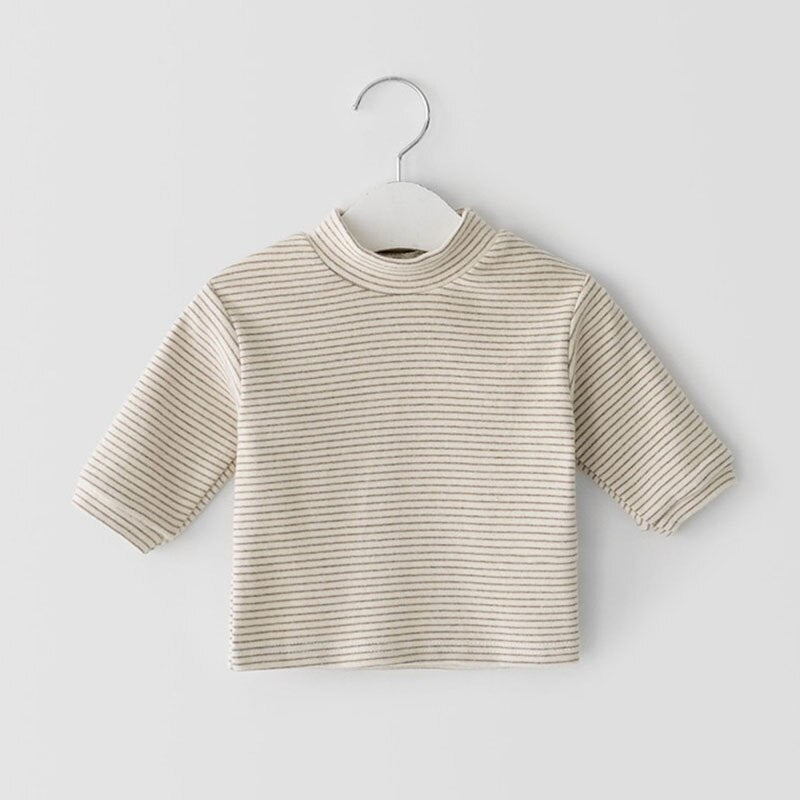 Beige striped mock neck top on a hanger