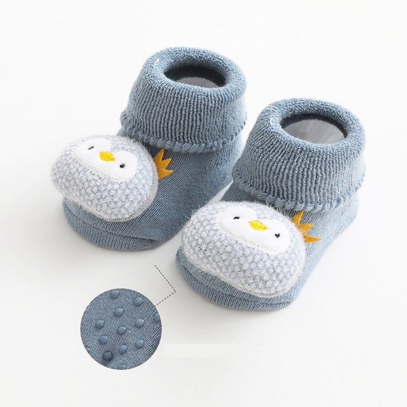 Blue thick baby socks with penguin toppers