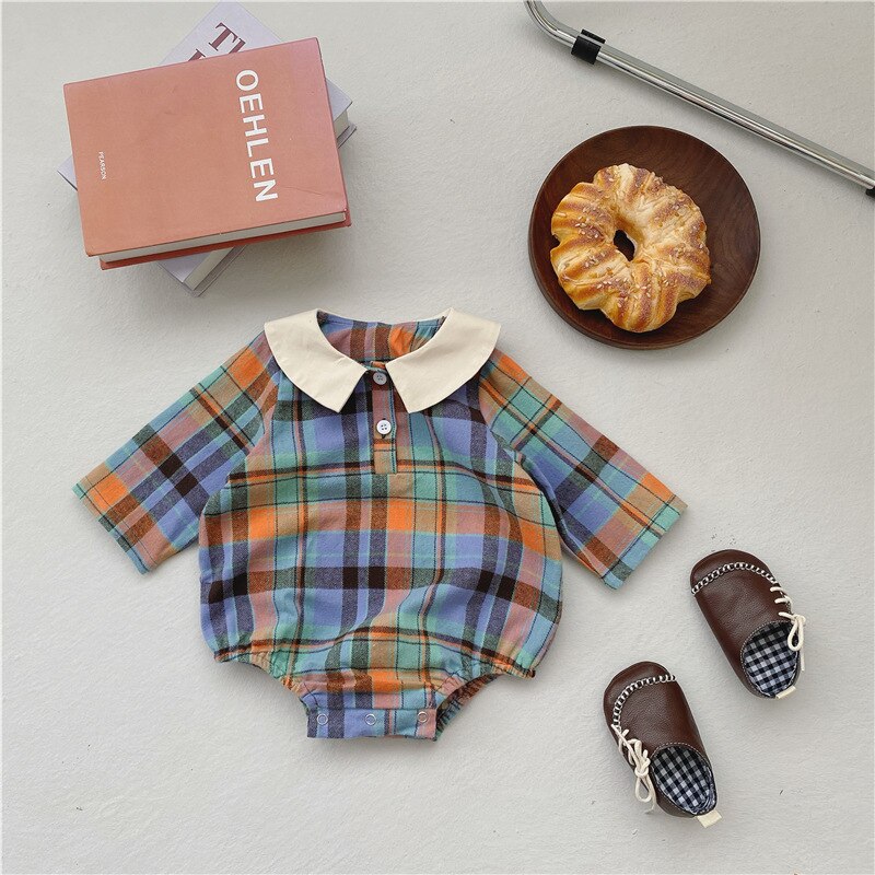 Blue plaid collar romper laid flat with shoes