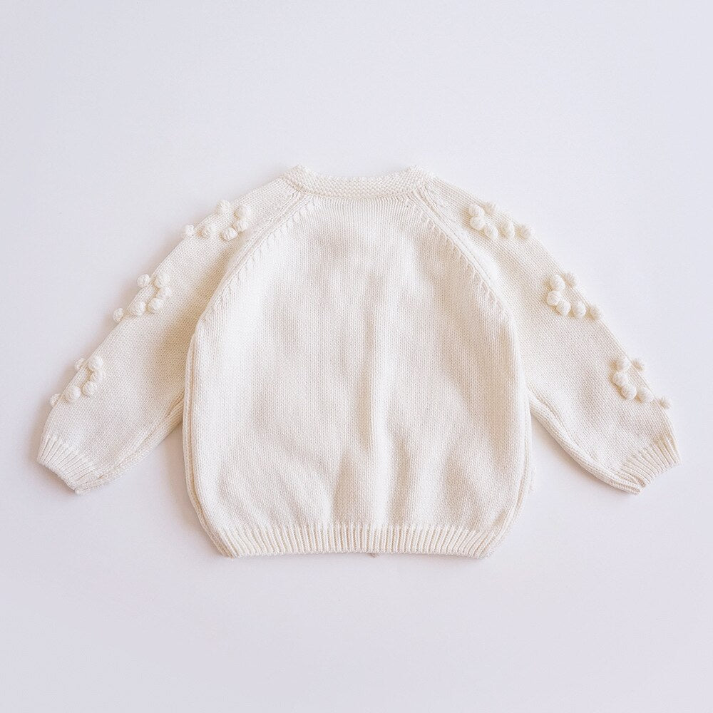 Back view of cream bobble knit cardigan