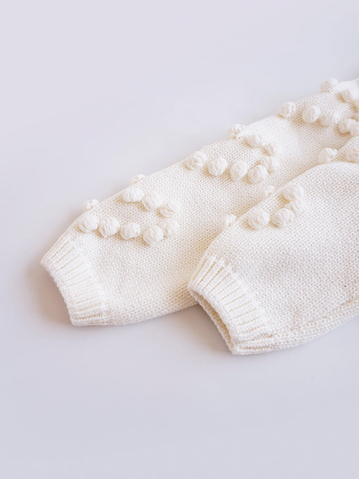 Close-up of ribbed cuffs on bobble cardigan