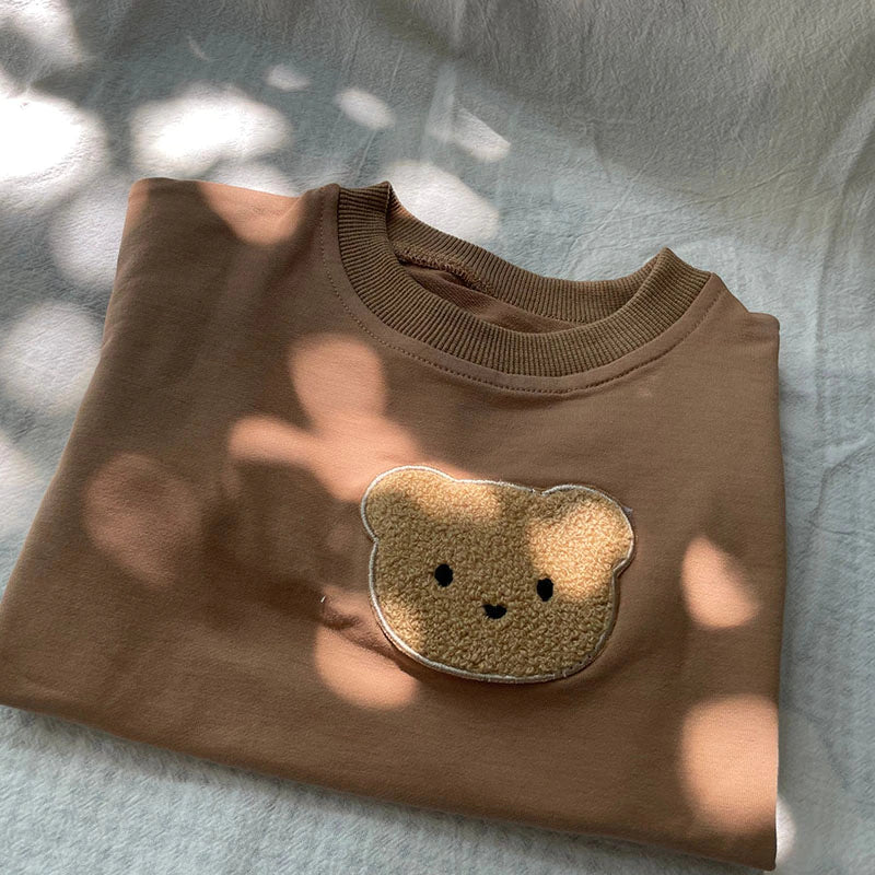Folded brown bear patch sweatshirt
