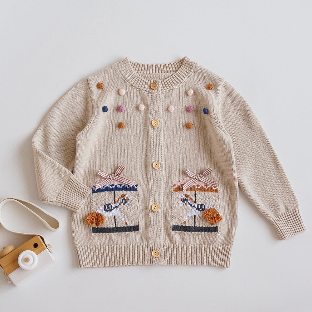 Khaki knit cardigan with carousel pockets and pom-poms