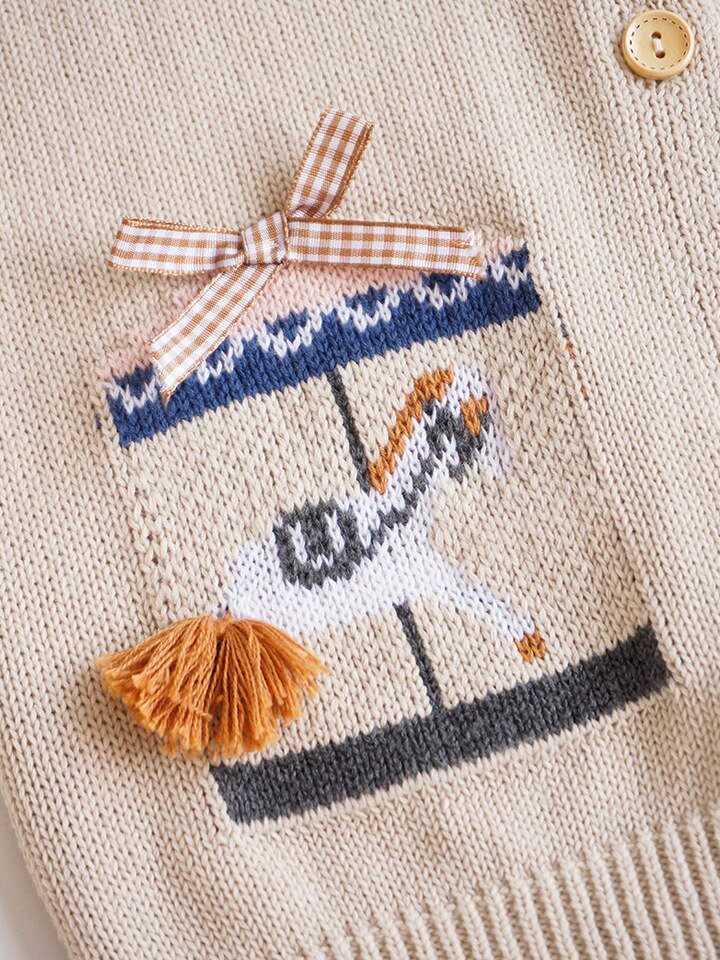 Close-up of carousel embroidery with tassel