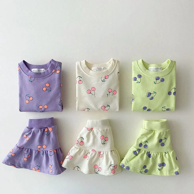 Purple, white and green cherry print top and skirt sets