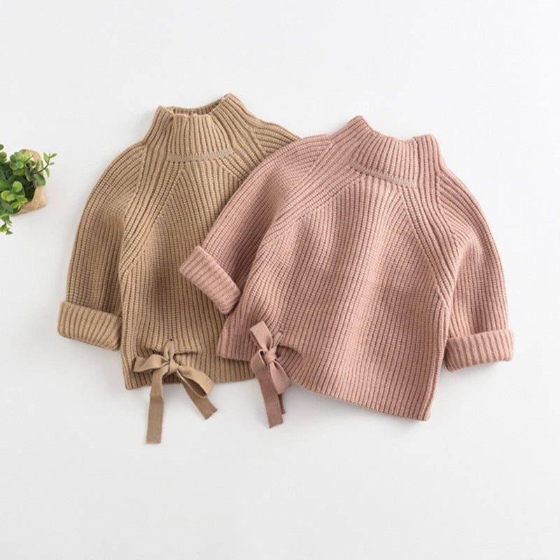Camel and pink chunky knit turtleneck sweaters