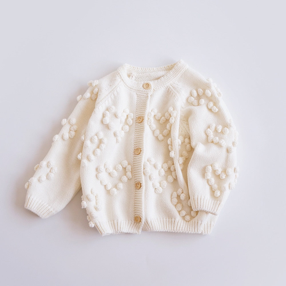 Cream knit cardigan with bobble hearts
