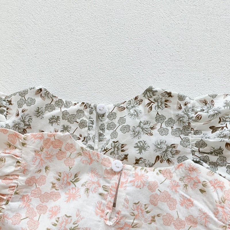 Close-up of back of floral dresses