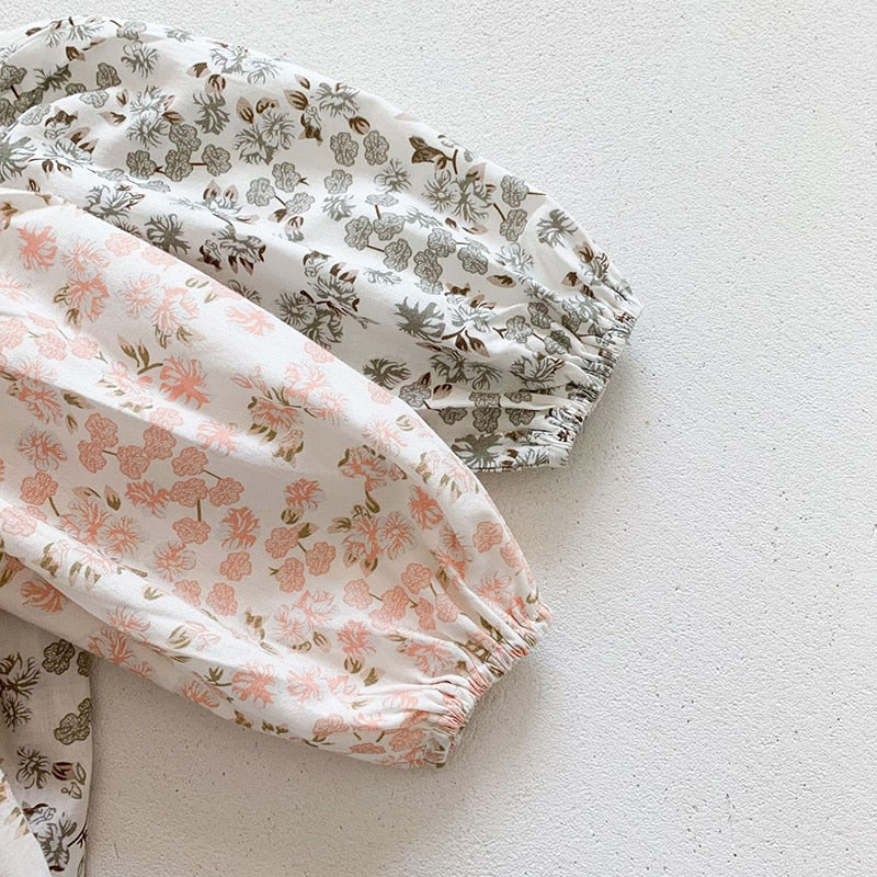 Close-up of puff sleeves on floral dresses