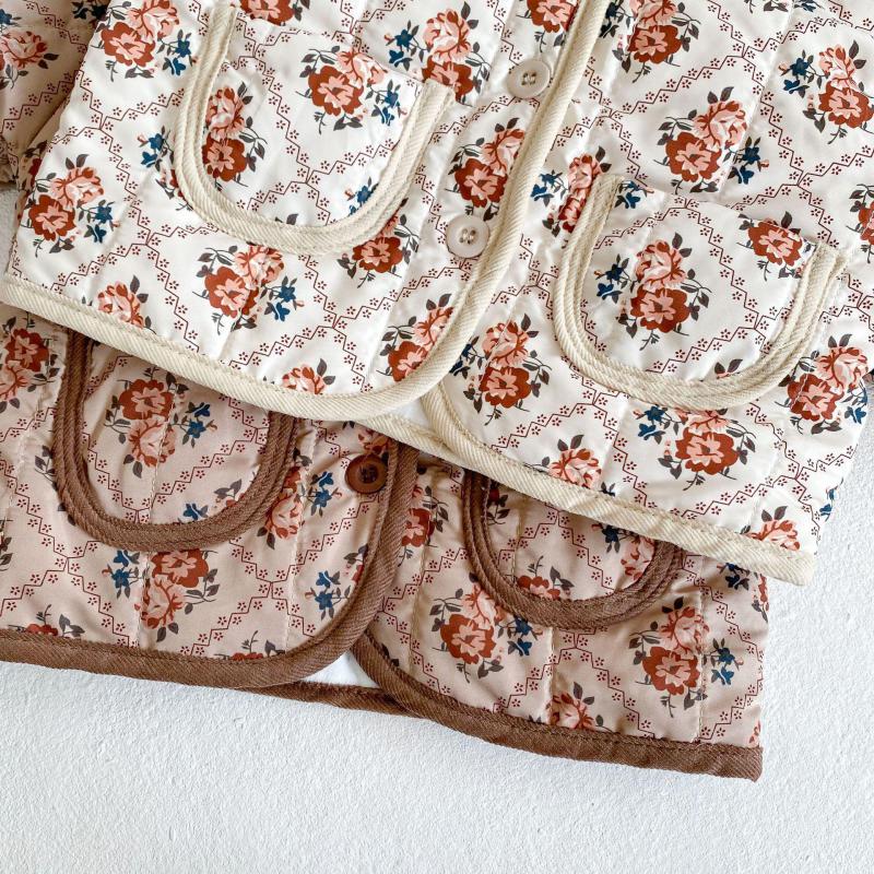 Close-up of pocket on white floral jacket