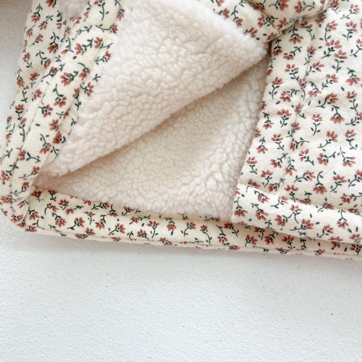 Front pocket detail on the floral quilted jacket
