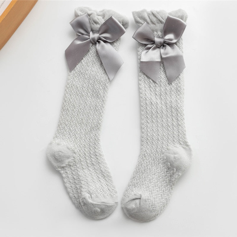 Gray openwork knee socks with satin bows